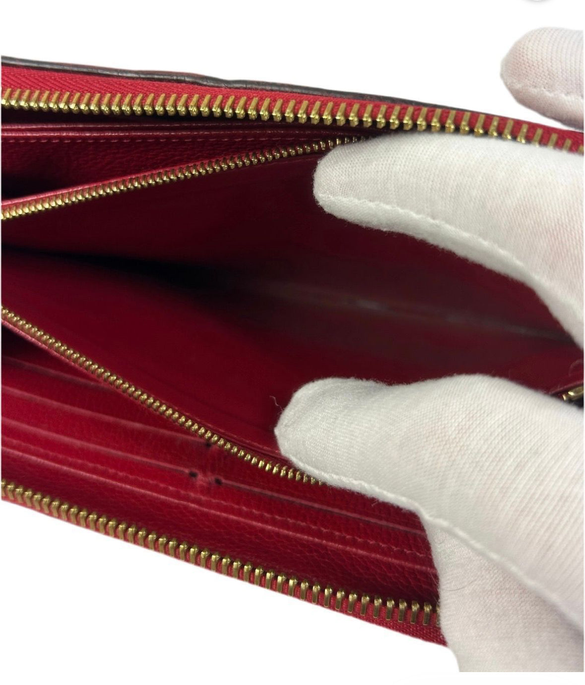 Louis Vuitton Monogram Empreinte Leather Zippy Wallet.