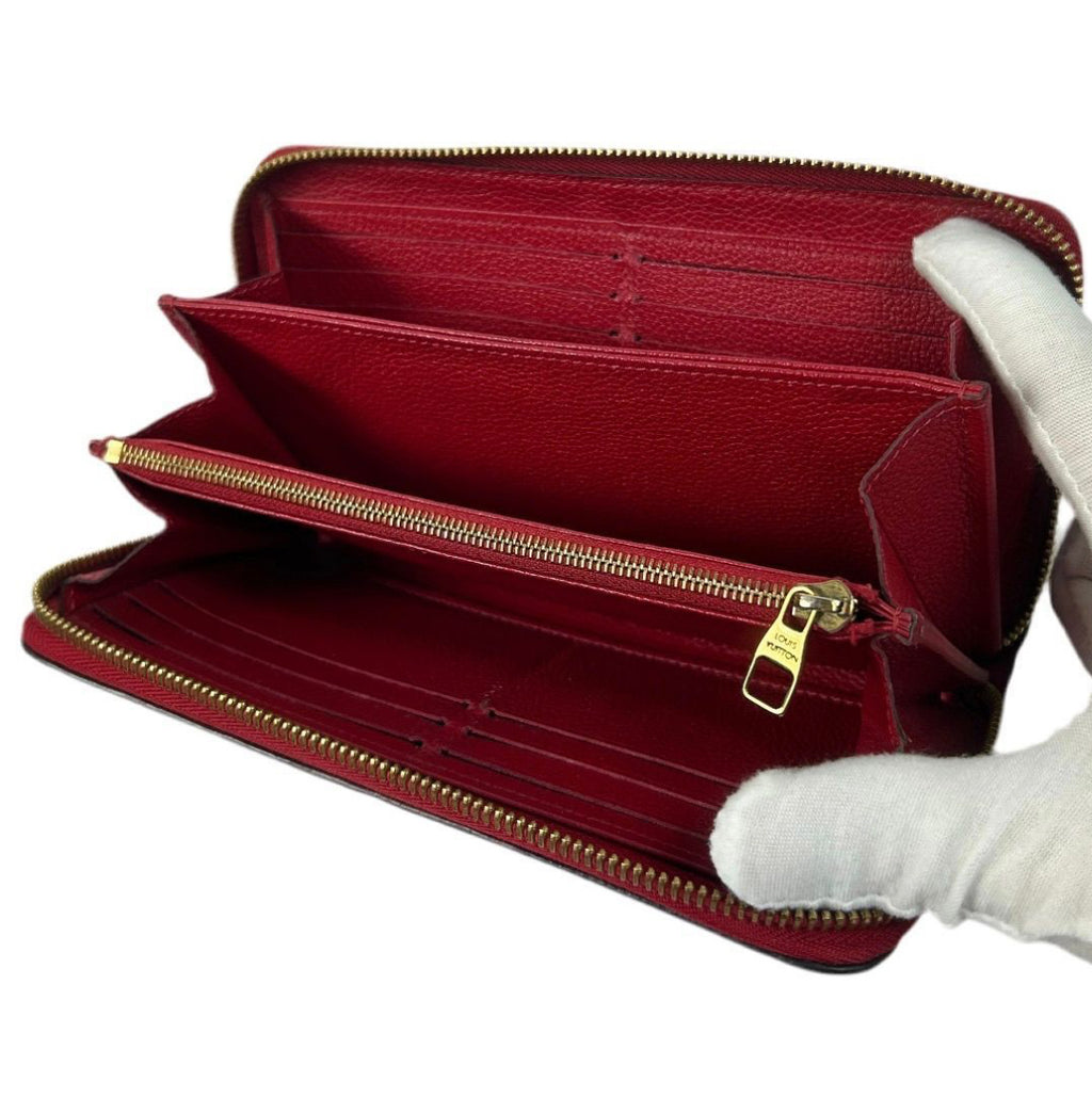 Louis Vuitton Monogram Empreinte Leather Zippy Wallet.