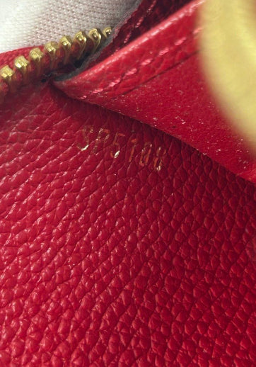Louis Vuitton Monogram Empreinte Leather Zippy Wallet.