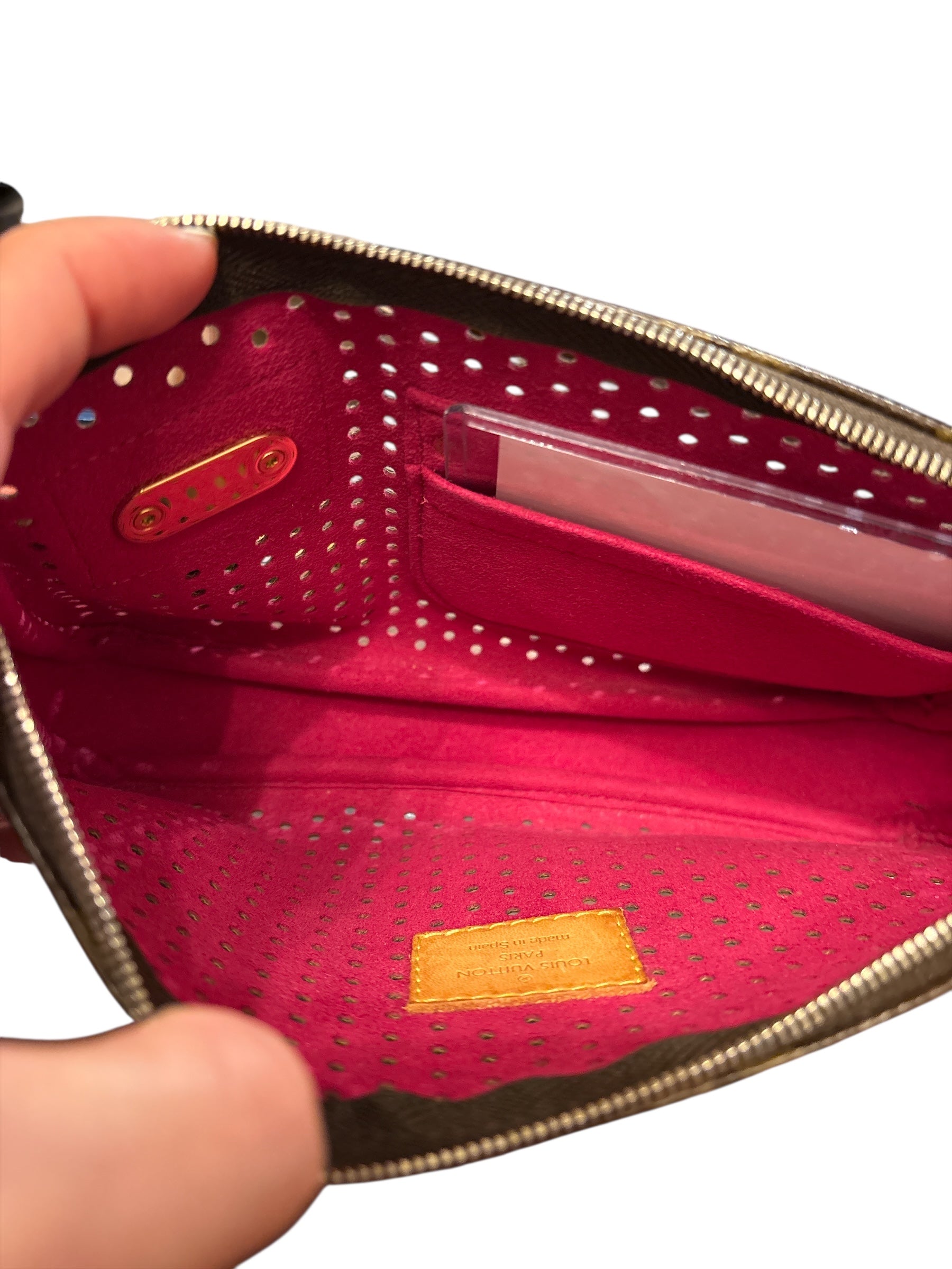Supper Rare Grail Louis Vuitton Pochette Perforated Fuschia.