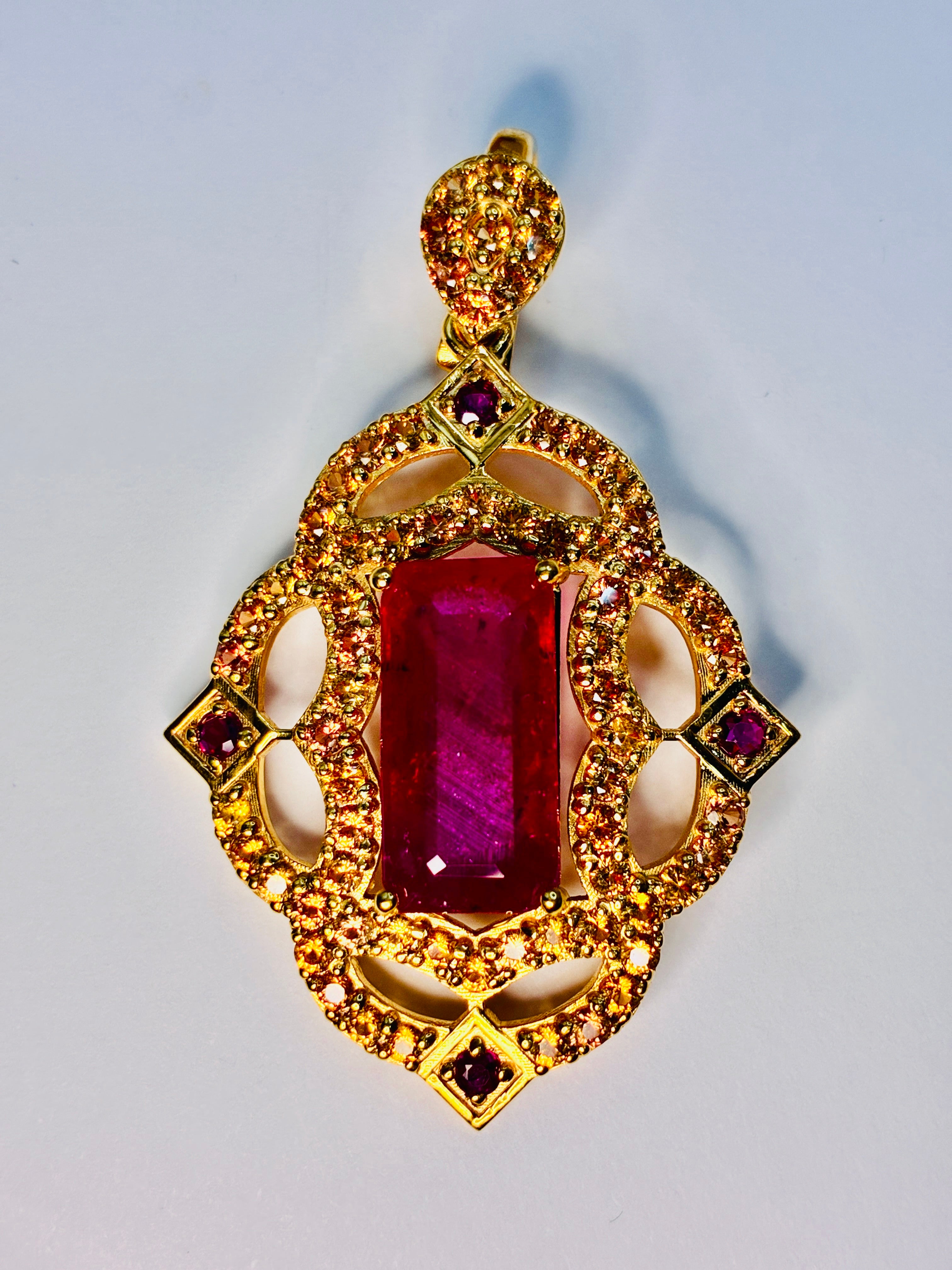 12.80 CT Africa Ruby, Cambodia Ruby And Yellow Sapphire 12K Gold Pendant.