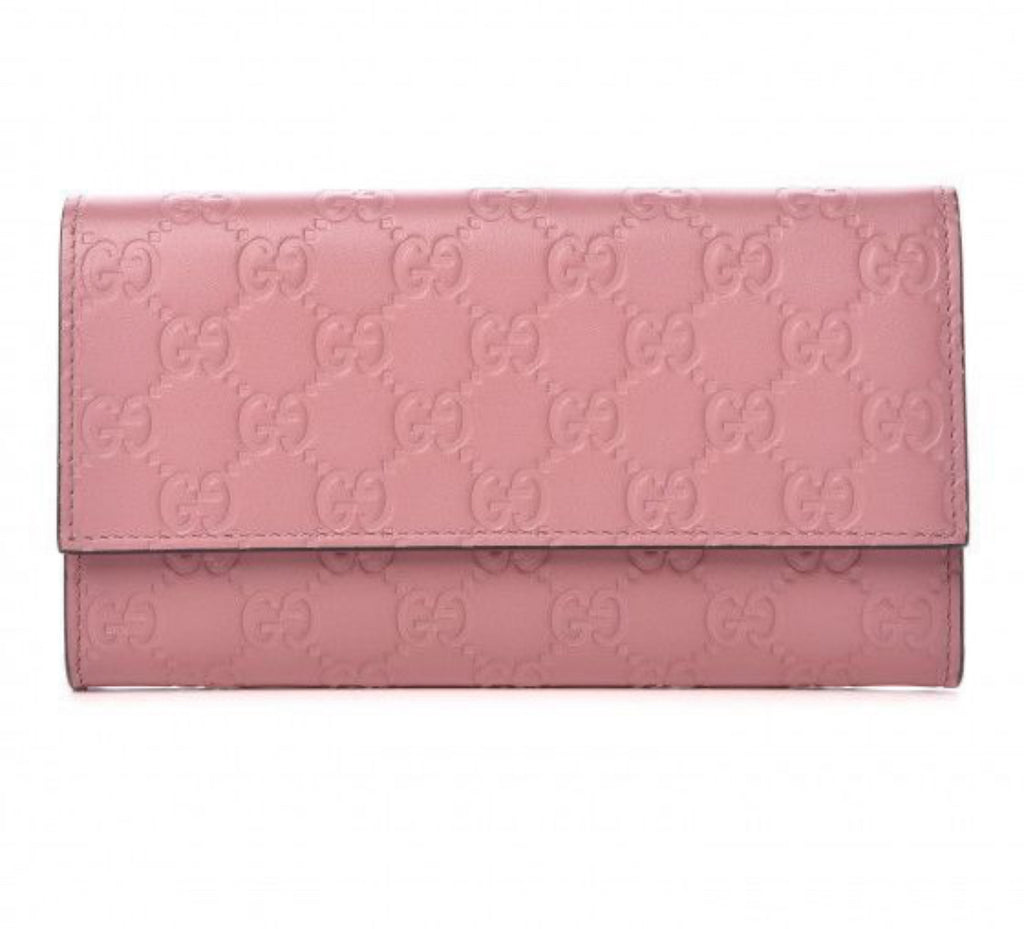 Authentic Gucci Mauve Imprint Half Flap Wallet.