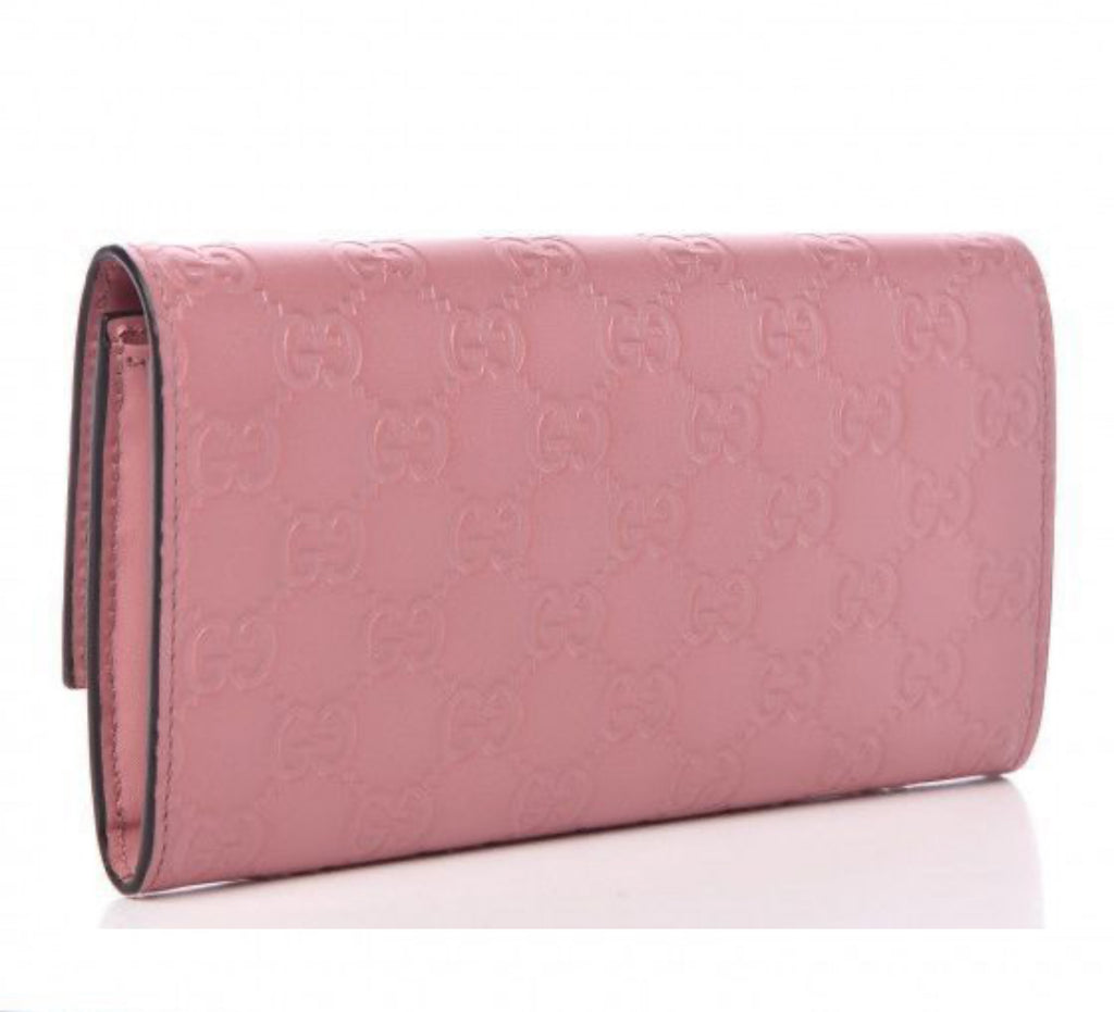Authentic Gucci Mauve Imprint Half Flap Wallet.