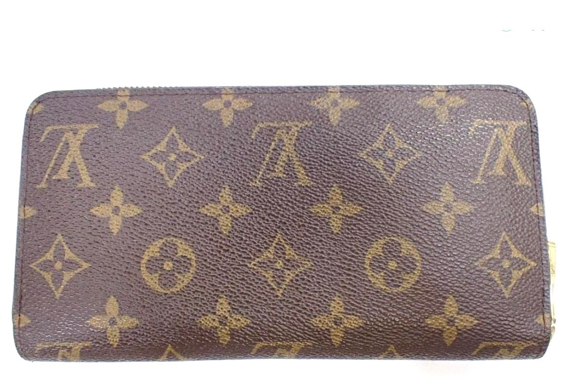 Louis Vuitton Monogram Zippy Wallet.